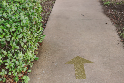 Gold Glitter Vinyl Sidewalk Arrows to Wedding Reception | EntertainingLife.com